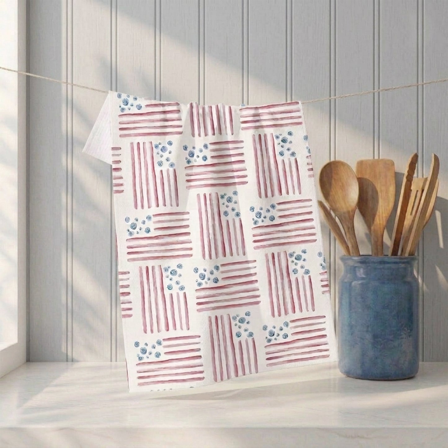 Red, White and Bloom watercolor flag tea towel hanging in kitchen setting with wood utensils — 723 & Co. Design Studio
