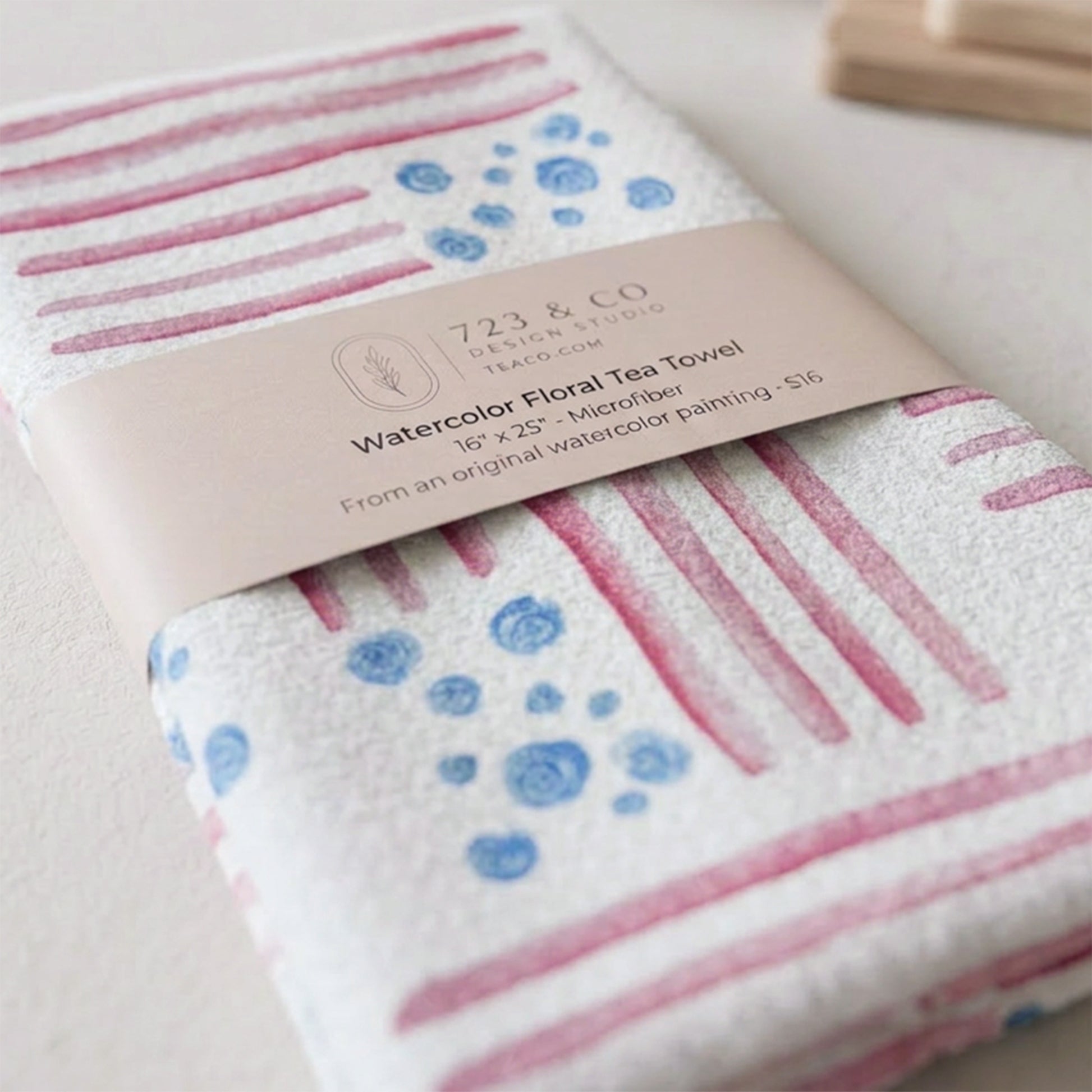 Red, White and Bloom tea towel folded with 723 & Co. Design Studio belly band packaging — watercolor patriotic kitchen linen