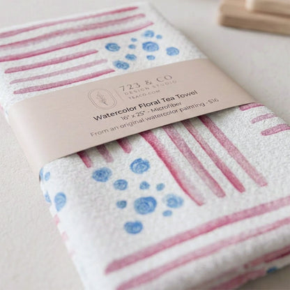 Red, White and Bloom tea towel folded with 723 & Co. Design Studio belly band packaging — watercolor patriotic kitchen linen
