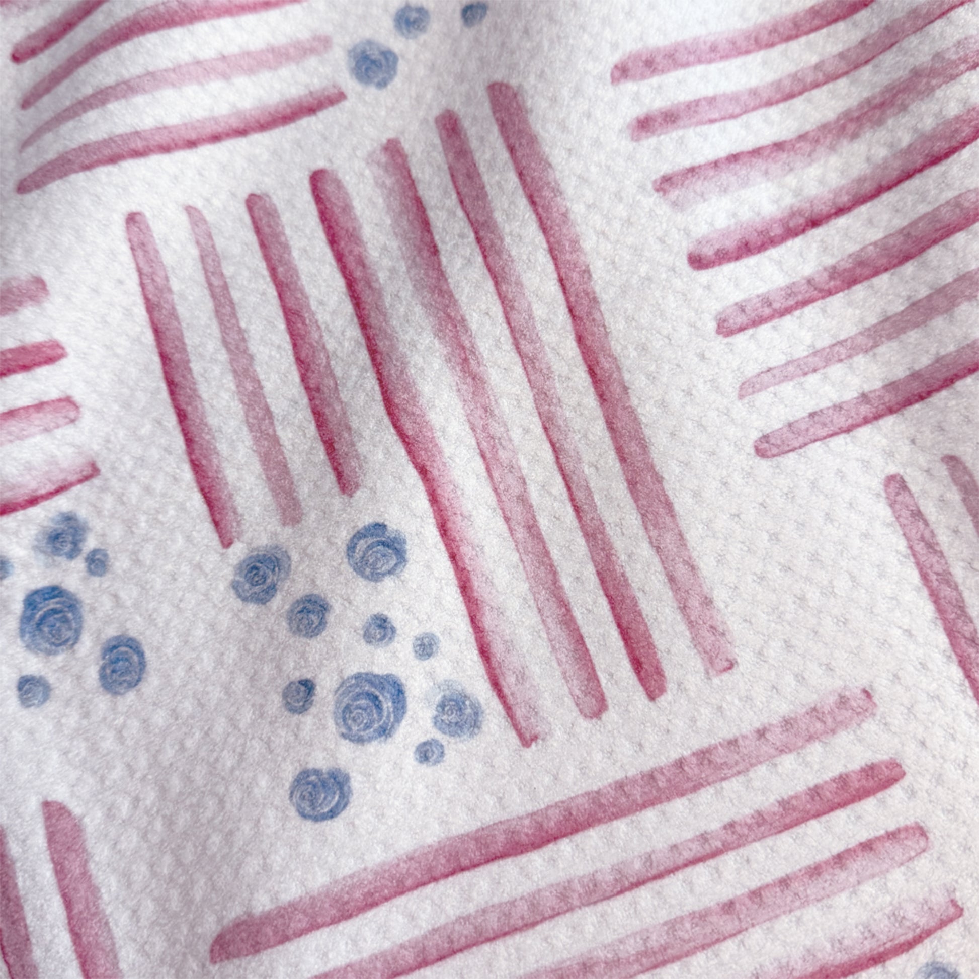 Close up detail of Red, White and Bloom watercolor tea towel showing soft red stripe and blue floral texture — 723 & Co. Design Studio