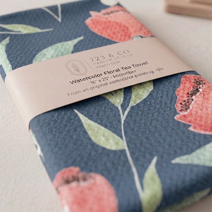 Midnight Blooms tea towel folded with 723 & Co. Design Studio belly band packaging — dark floral watercolor kitchen linen