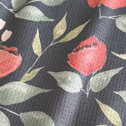 Close up detail of Midnight Blooms watercolor tea towel showing deep salmon blooms and sage green leaves on midnight navy — 723 & Co. Design Studio