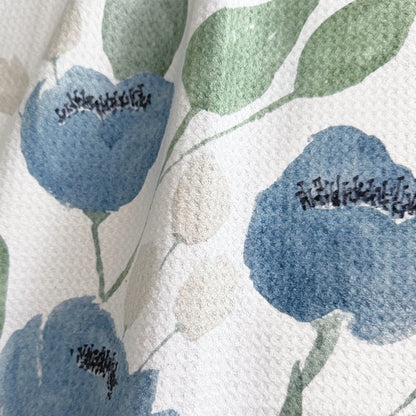 Close up detail of Indigo Garden watercolor tea towel showing steel blue blooms and sage green leaves — 723 & Co. Design Studio