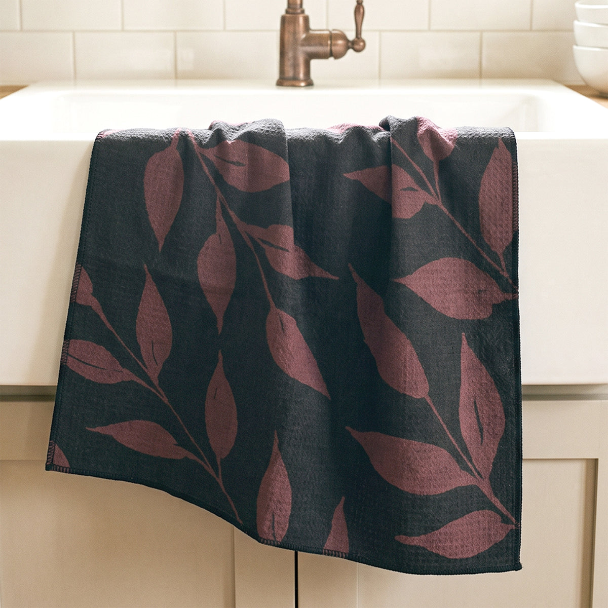 Fig Wild Leaves watercolor tea towel draped over farmhouse sink with brass faucet — fall kitchen linen by 723 & Co. Design Studio