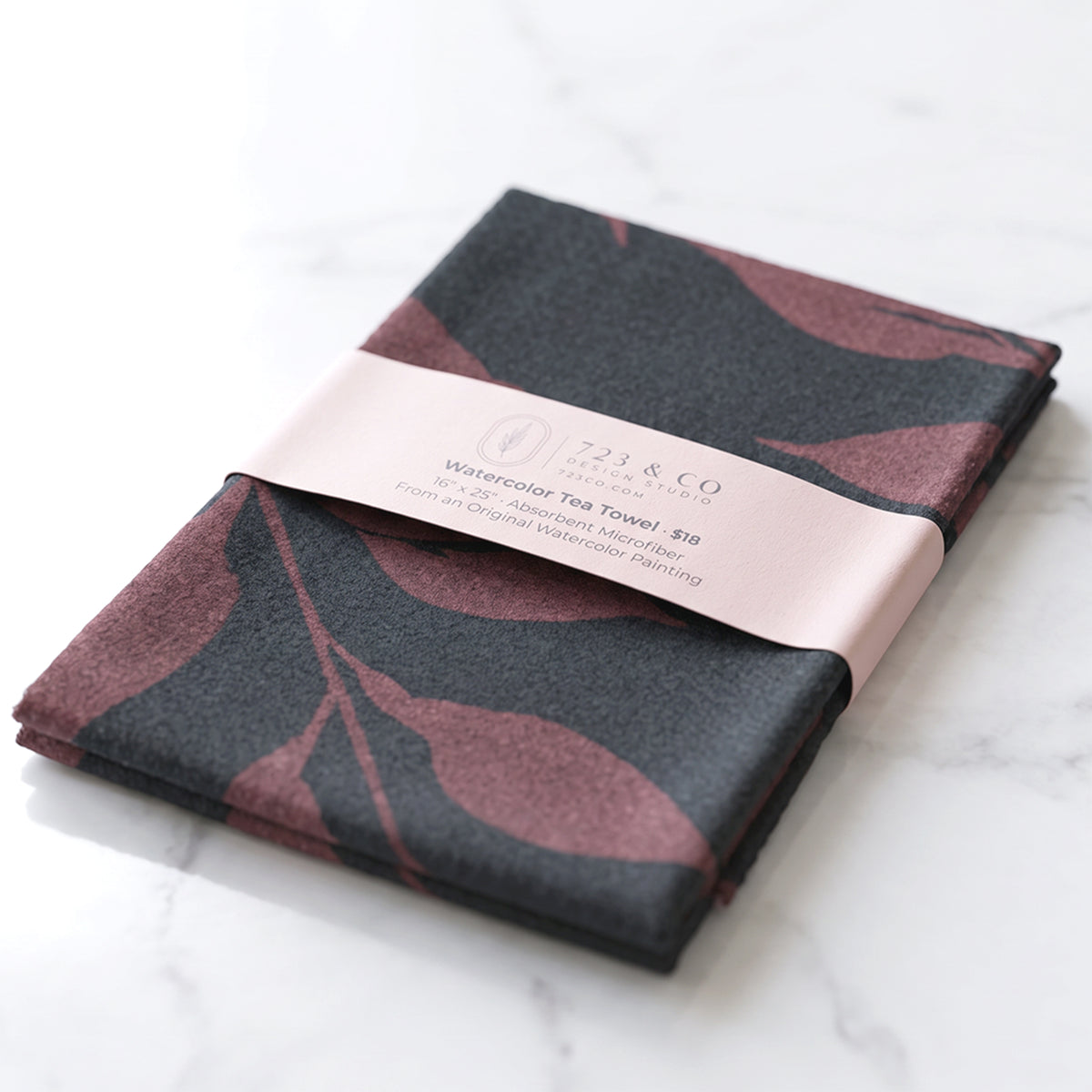 Fig Wild Leaves tea towel folded with 723 & Co. Design Studio belly band packaging — botanical watercolor kitchen linen