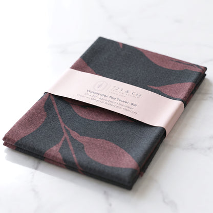 Fig Wild Leaves tea towel folded with 723 & Co. Design Studio belly band packaging — botanical watercolor kitchen linen