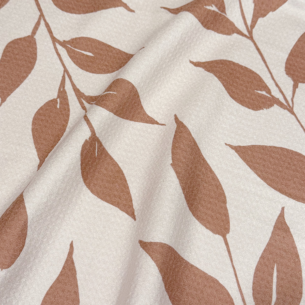Close up detail of Harvest Wild Leaves watercolor tea towel showing warm terracotta botanical leaves on cream background, 723 & Co. Design Studio