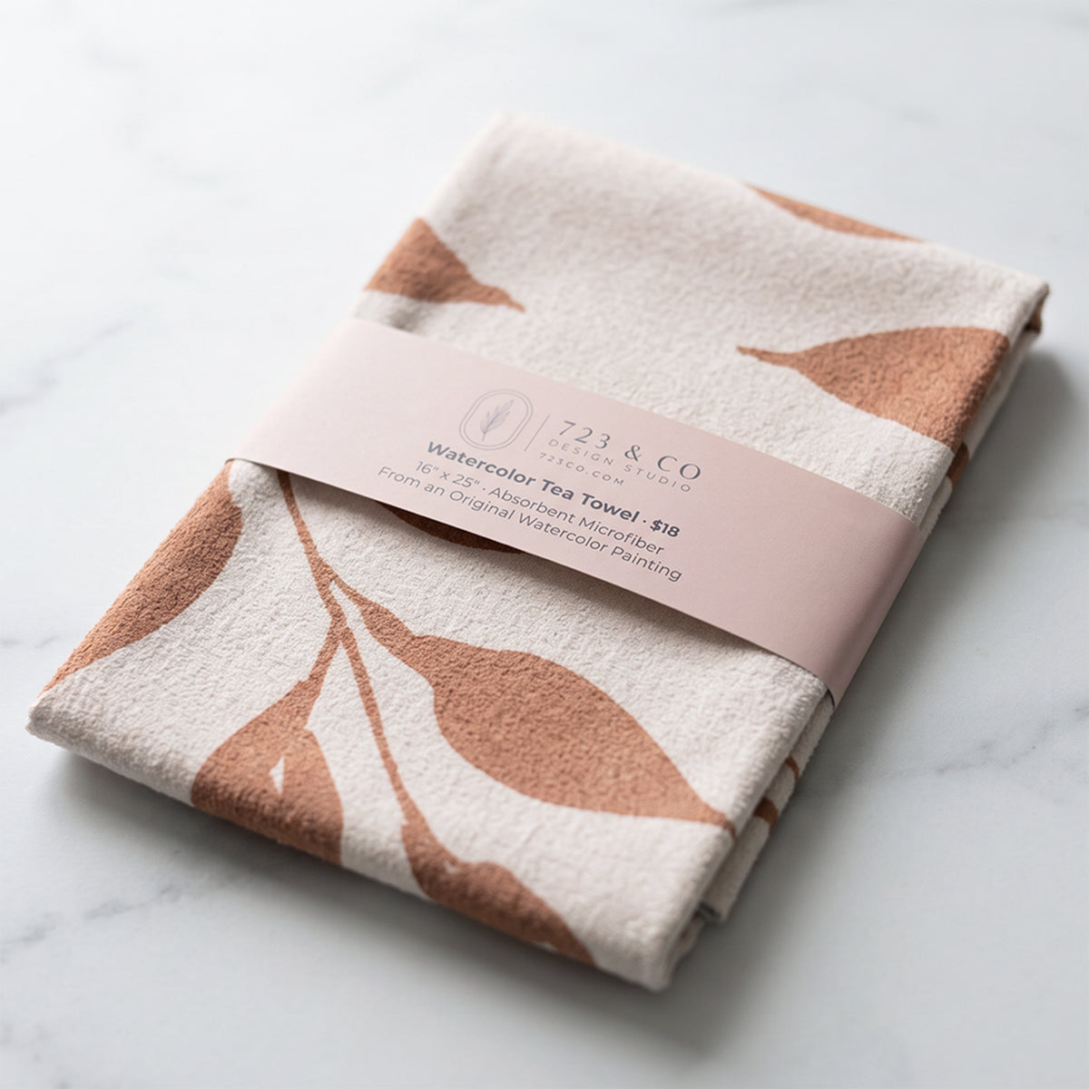 Harvest Wild Leaves tea towel folded with 723 & Co. Design Studio belly band packaging, botanical watercolor kitchen linen