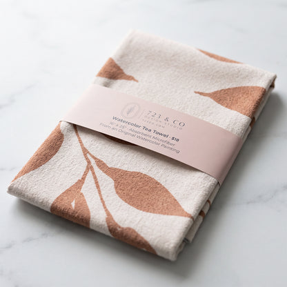 Harvest Wild Leaves tea towel folded with 723 & Co. Design Studio belly band packaging, botanical watercolor kitchen linen