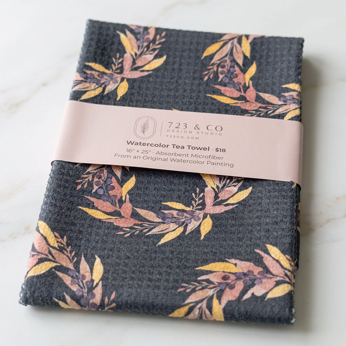 Harvest Wreath tea towel folded with 723 & Co. Design Studio belly band packaging — autumn watercolor kitchen linen