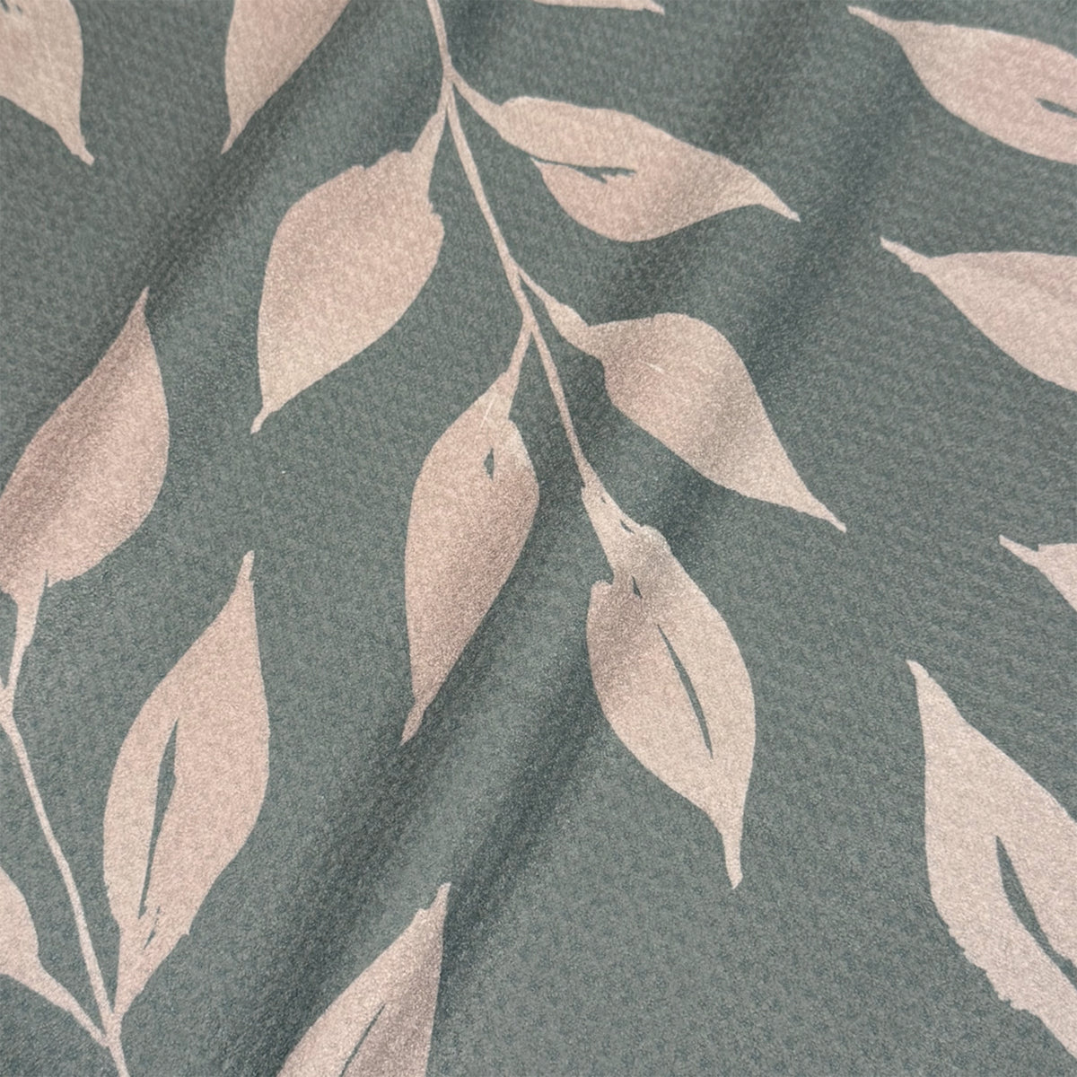 Close up detail of Sage Wild Leaves watercolor tea towel showing oversized warm taupe leaf silhouettes on slate green, 723 & Co. Design Studio