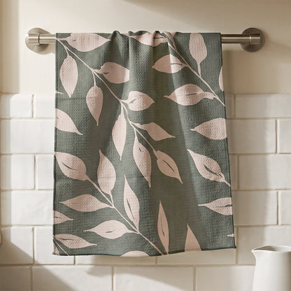 Sage Wild Leaves watercolor botanical tea towel hanging in kitchen setting with natural wood and white tile, 723 & Co. Design Studio