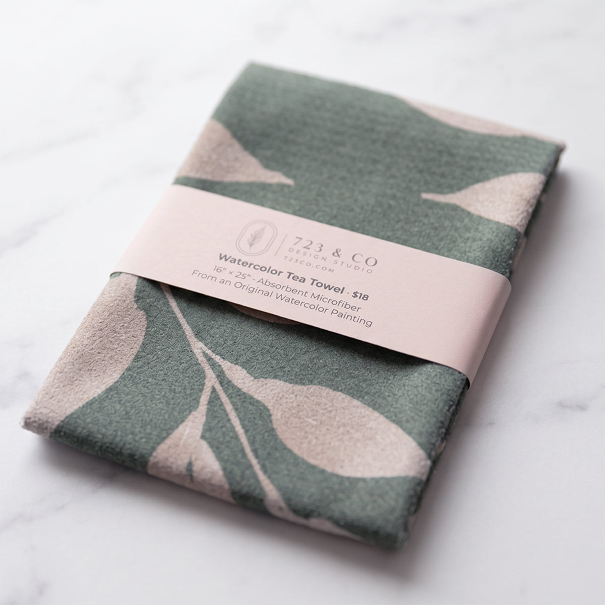 Sage Wild Leaves tea towel folded with 723 & Co. Design Studio belly band packaging, watercolor botanical kitchen linen
